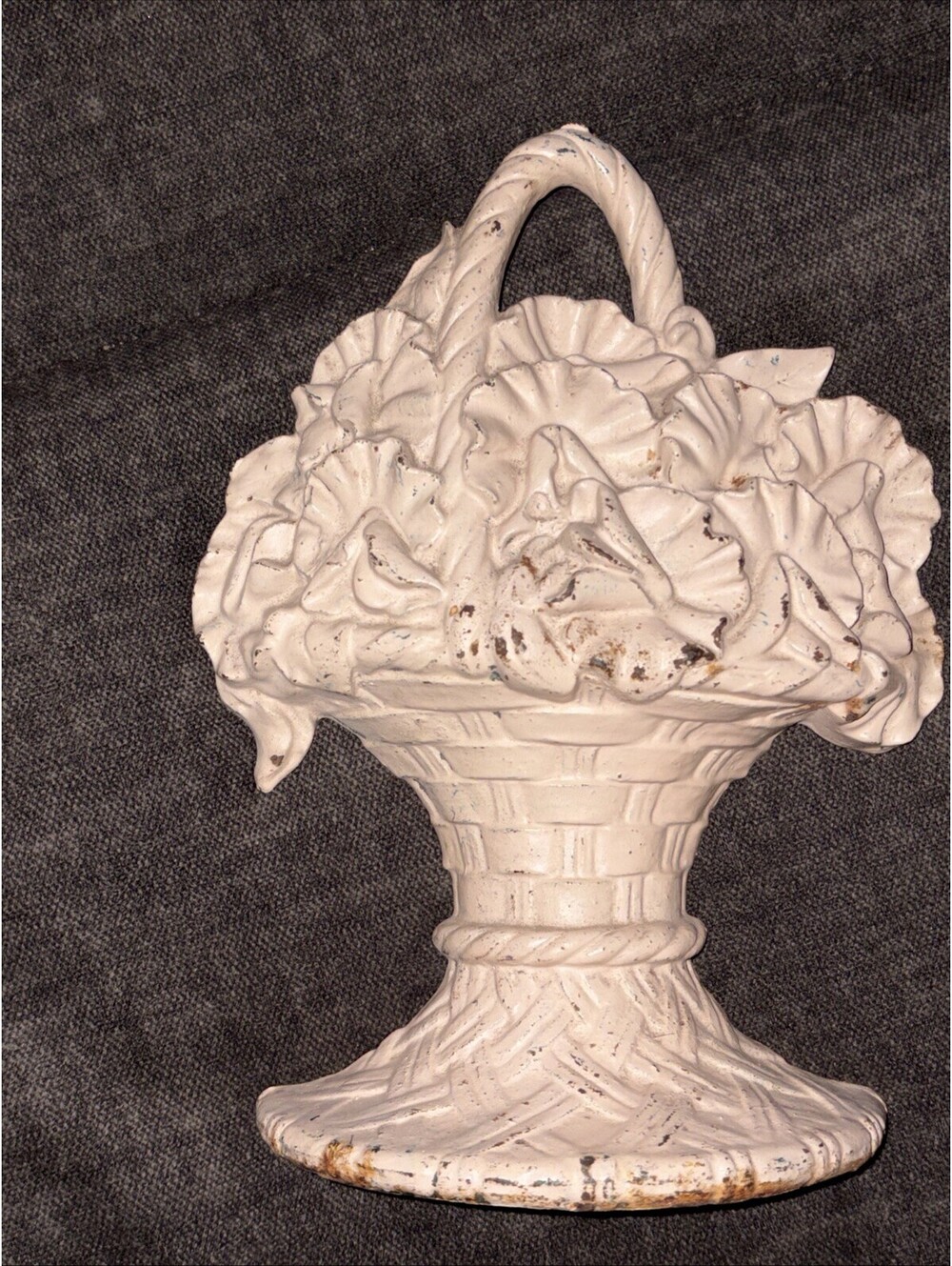 antique Hubley cast iron doorstop featuring a bouquet of flowers in a basket